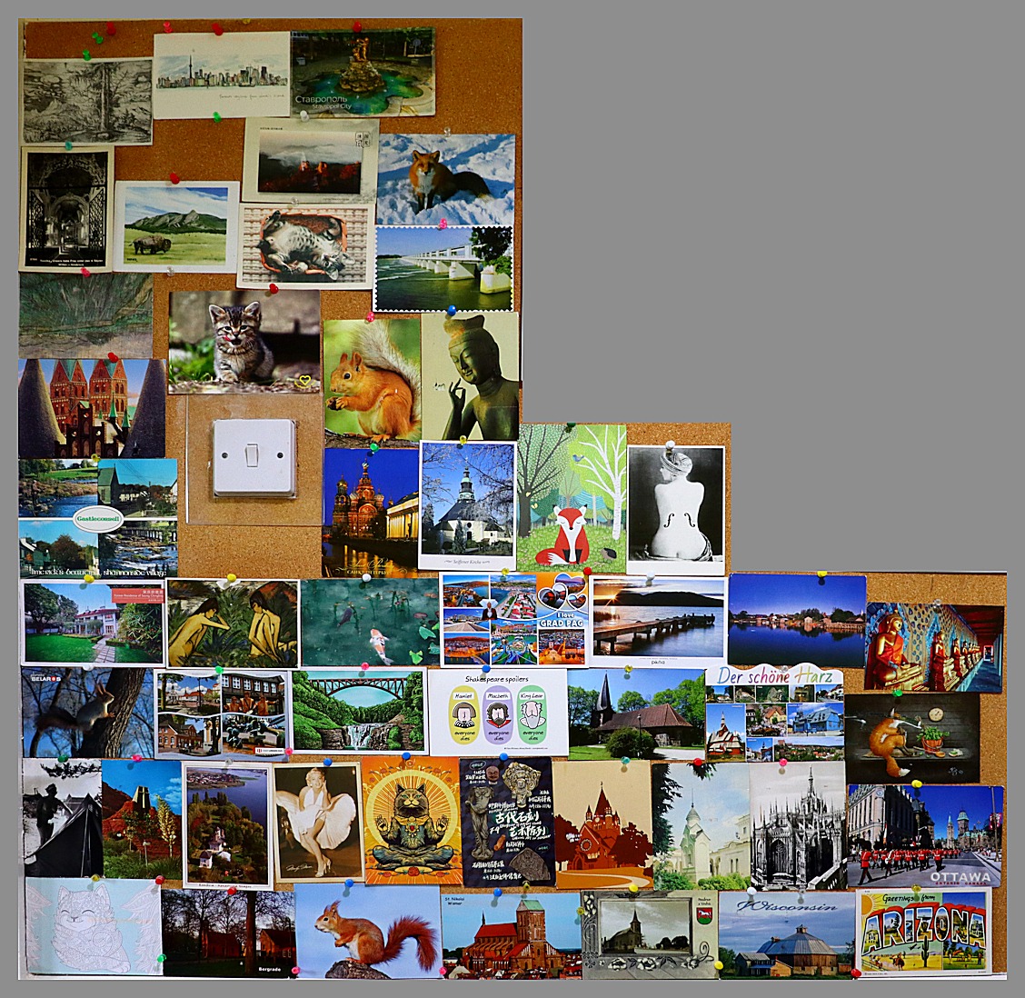 noticeboard covered with postcards