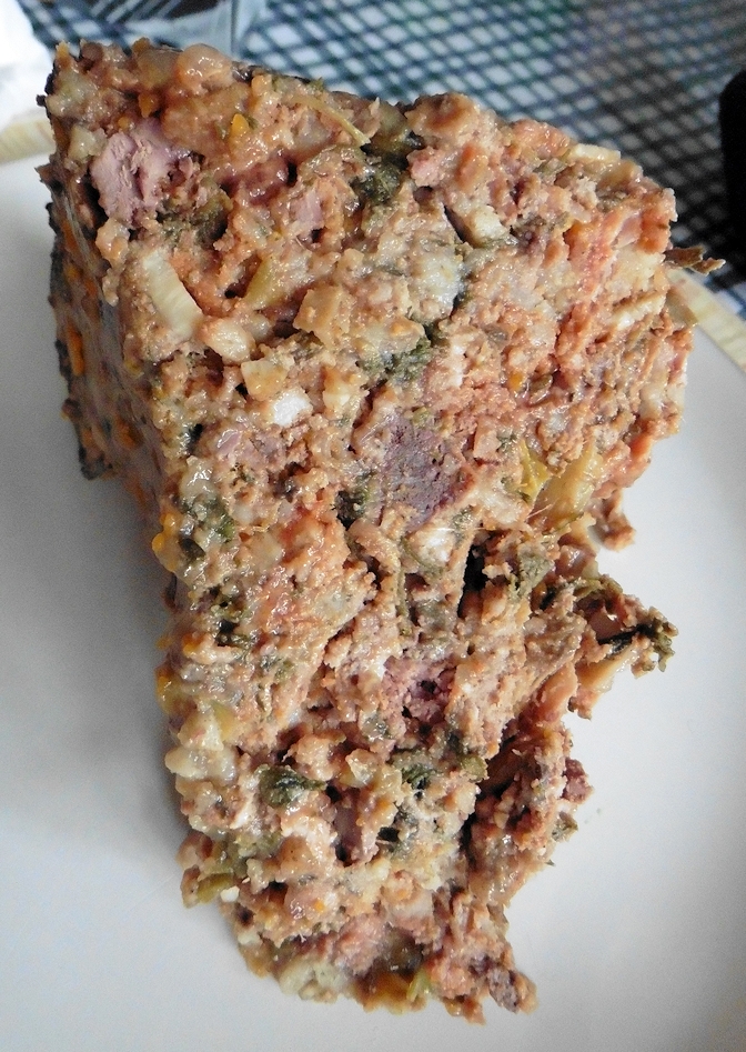 A wedge of terrine on a plate
