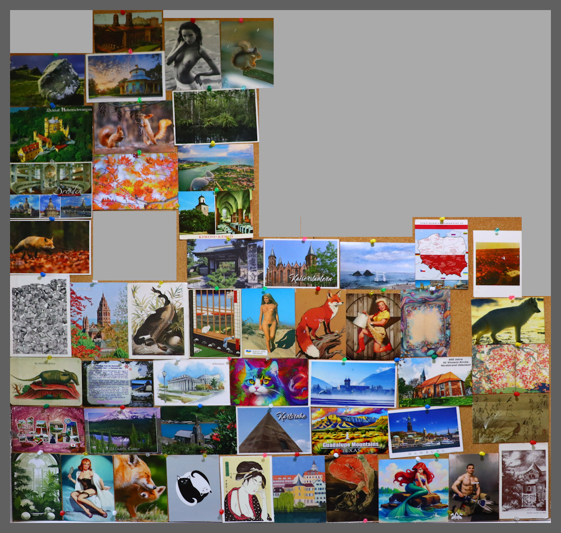 cork board covered in postcards