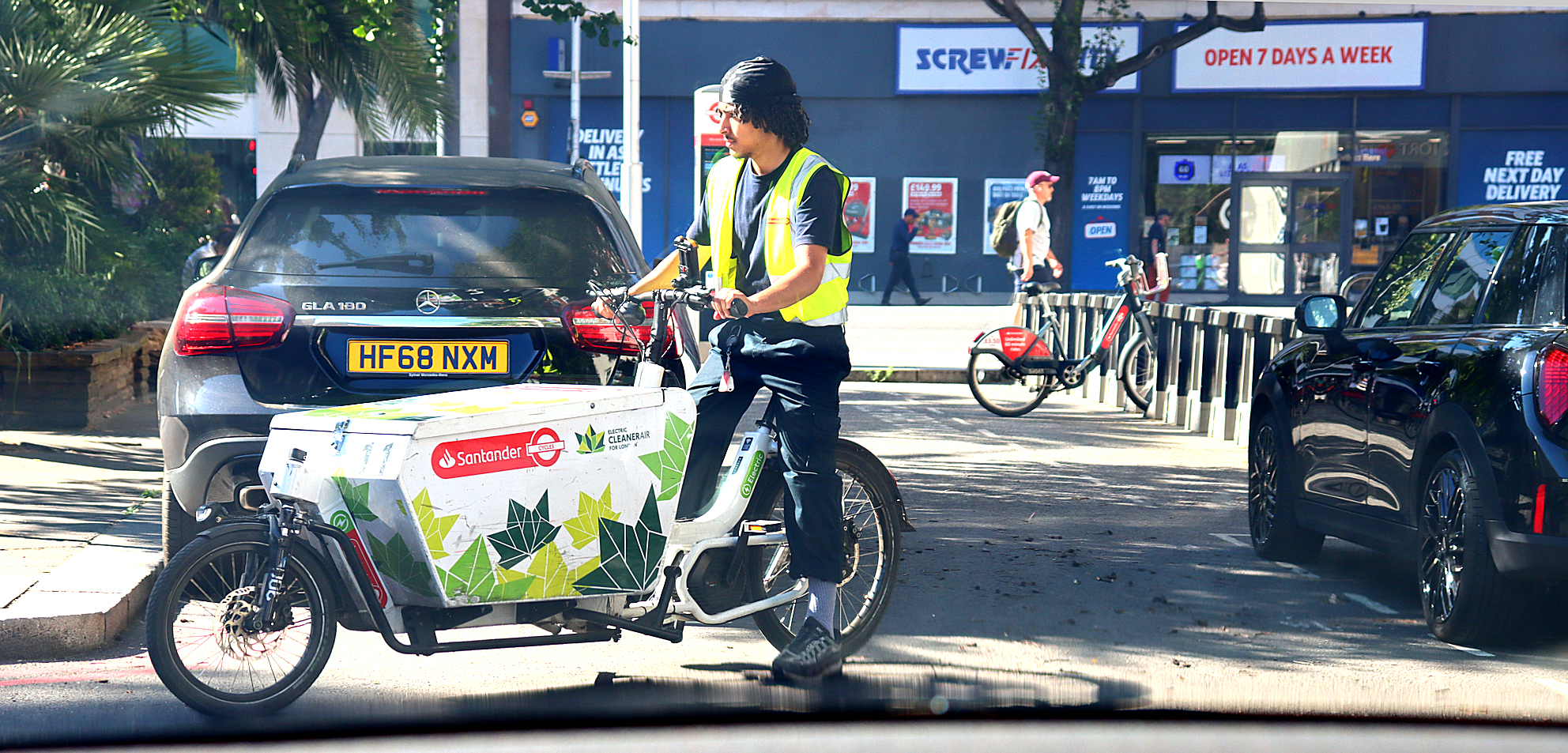 young man on a modern delivery bike